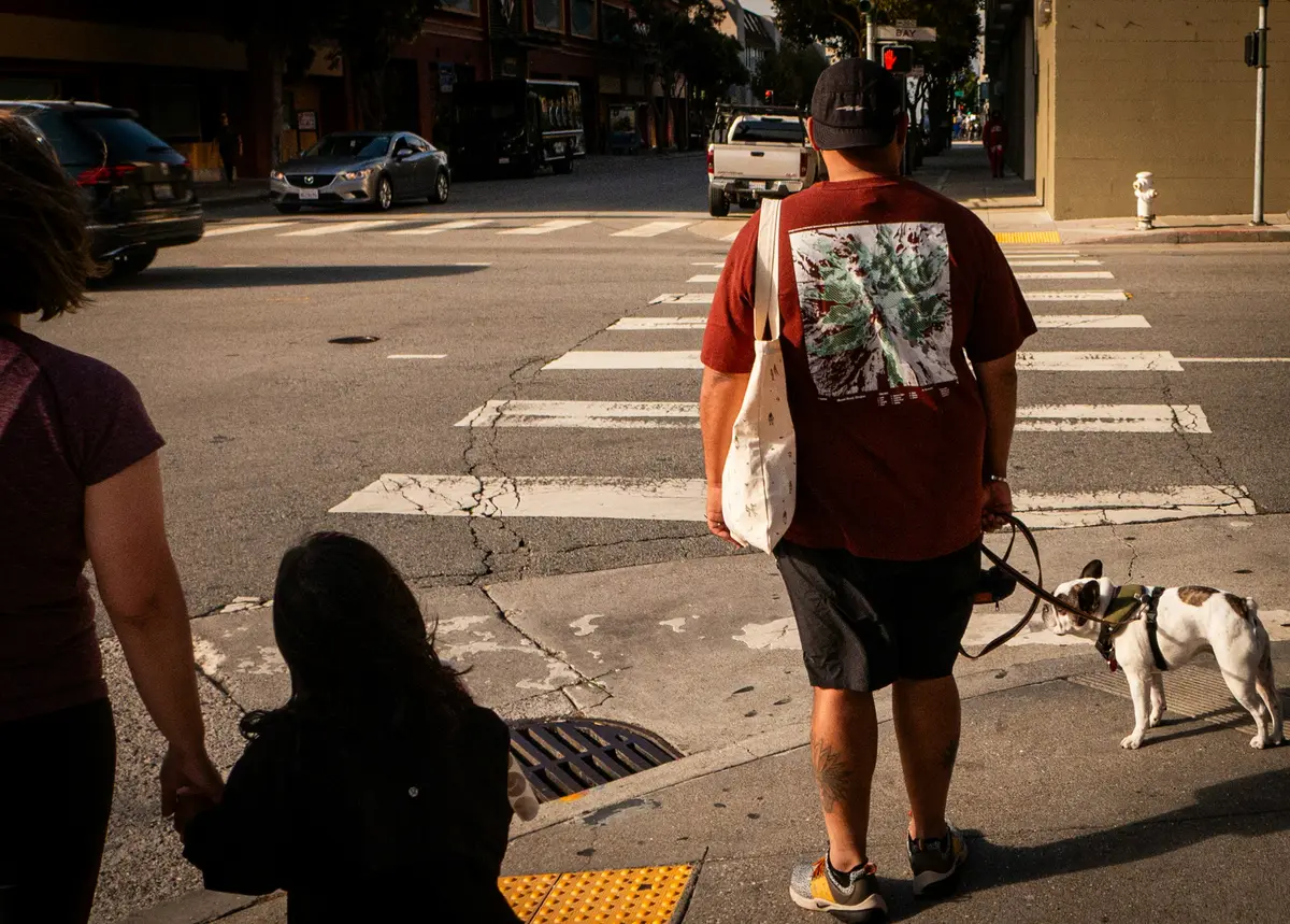 People crossing a busy Los Angeles crosswalk