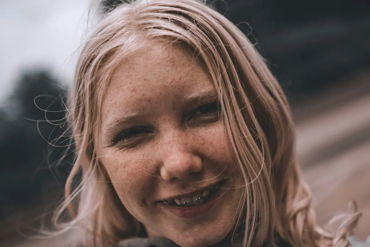 A smiling teenager outdoors