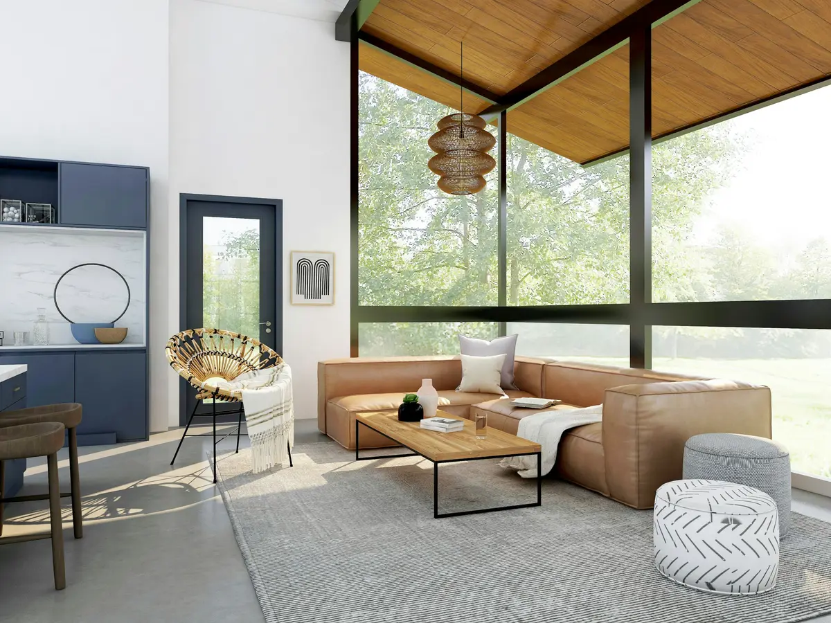 A living room with glass walls and a wood ceiling looking into trees
