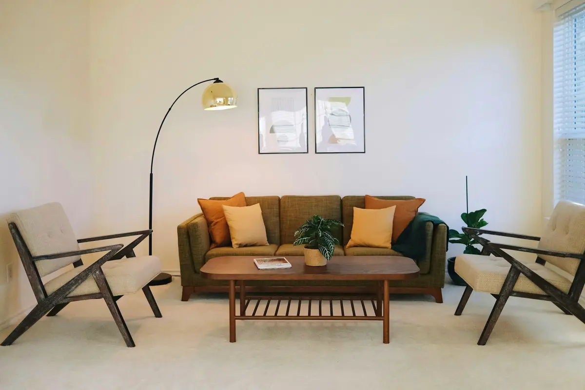Living room with an olive sofa and two lounge chairs