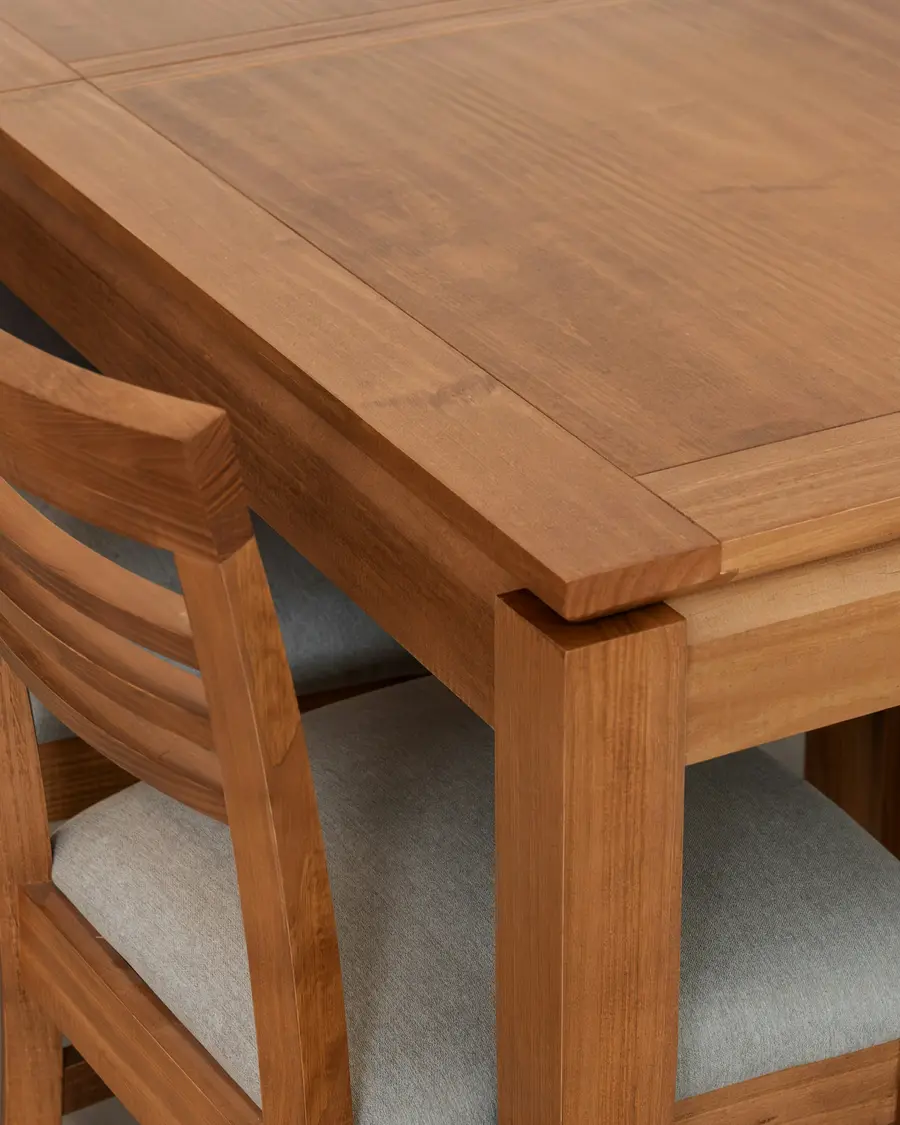 The corner joint where the table leg meets the top