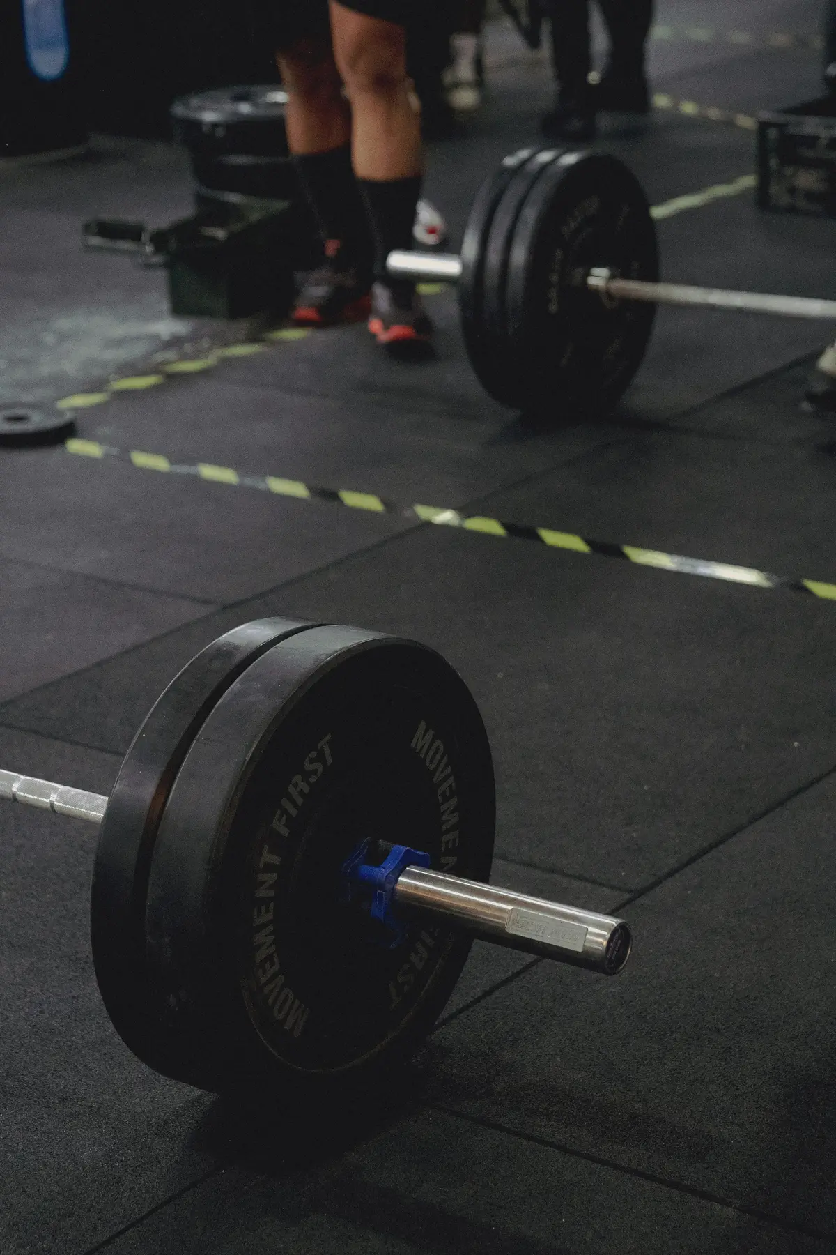 Barbells set up in an empty gym