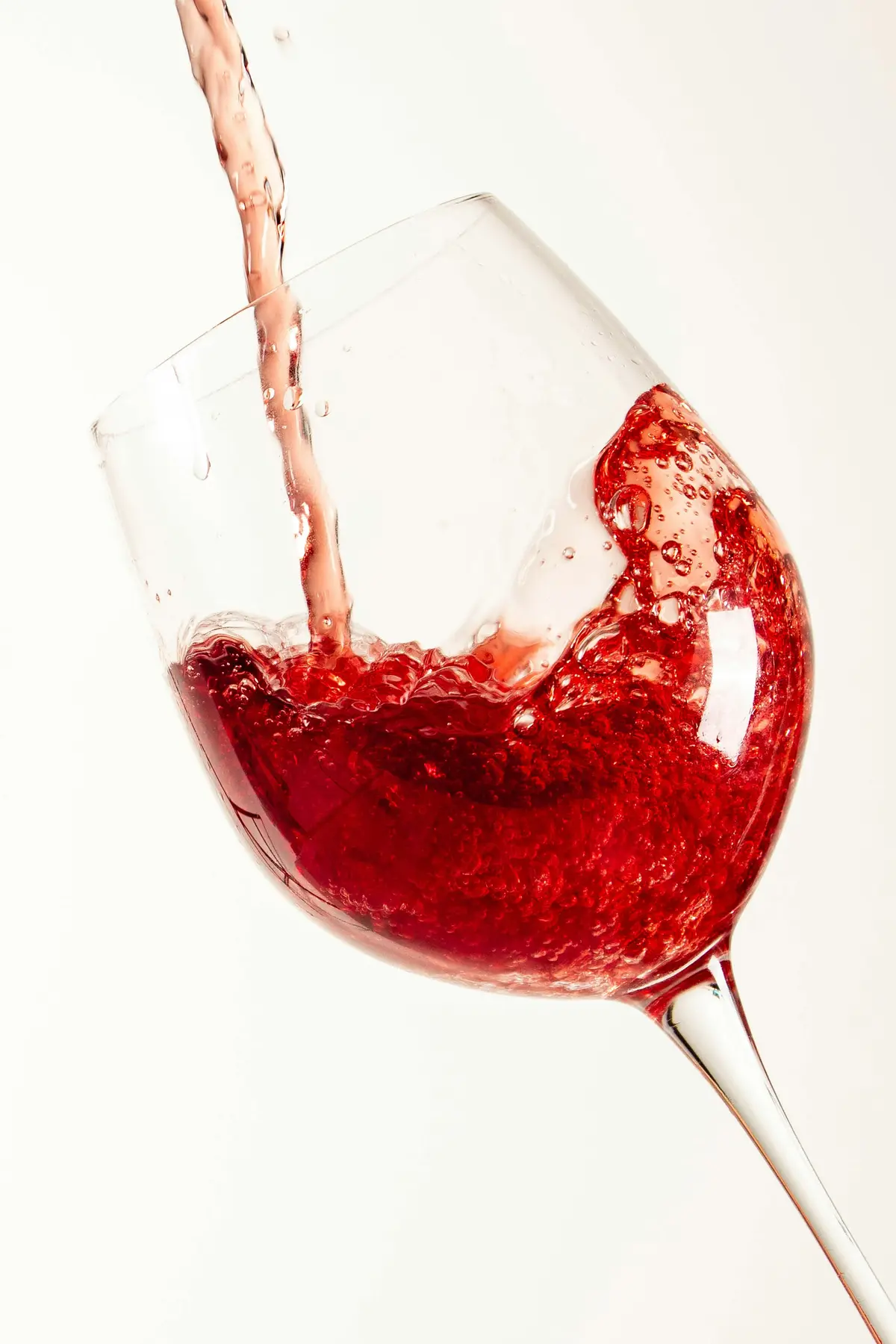 Red wine being poured into a glass