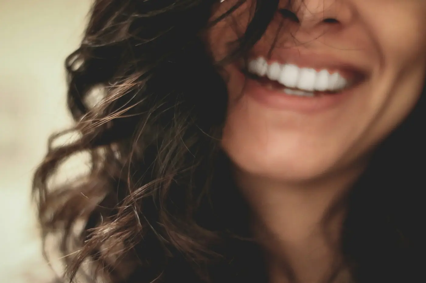 A close-up of a woman smiling